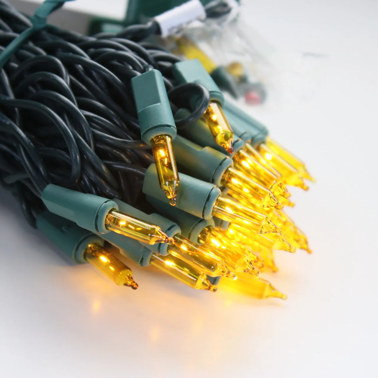 100-bulb Yellow Mini Lights, 4" Spacing, Green Wire