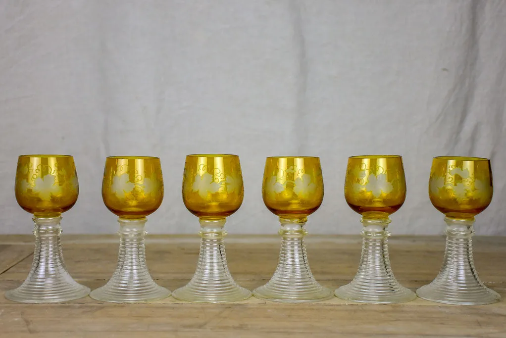 Six white wine glasses from Alsace with engraved decoration and broad ribbed bases